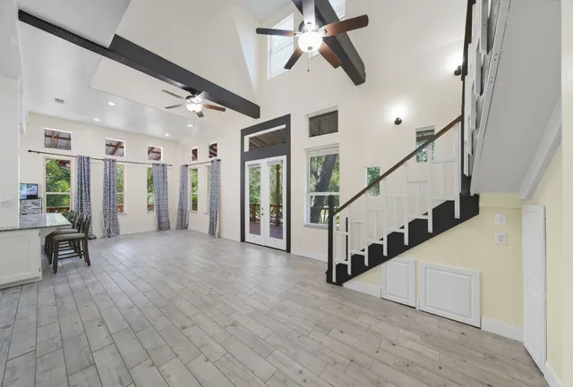 a view of entryway and hall with wooden floor