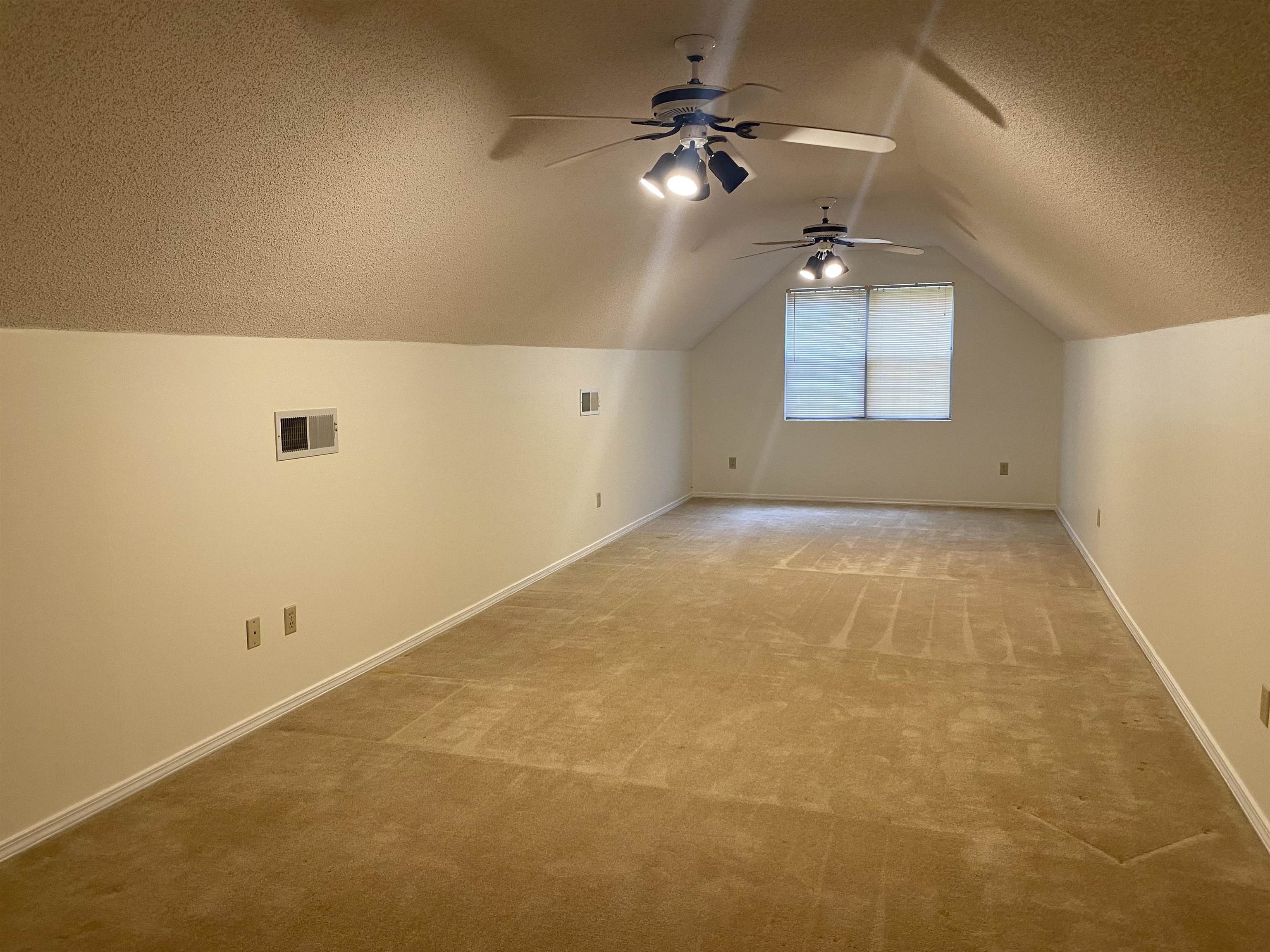 339 Dove Valley Road Collierville, TN 38017 - Photo 16 of 20 a view of a big room with windows and ceiling fan