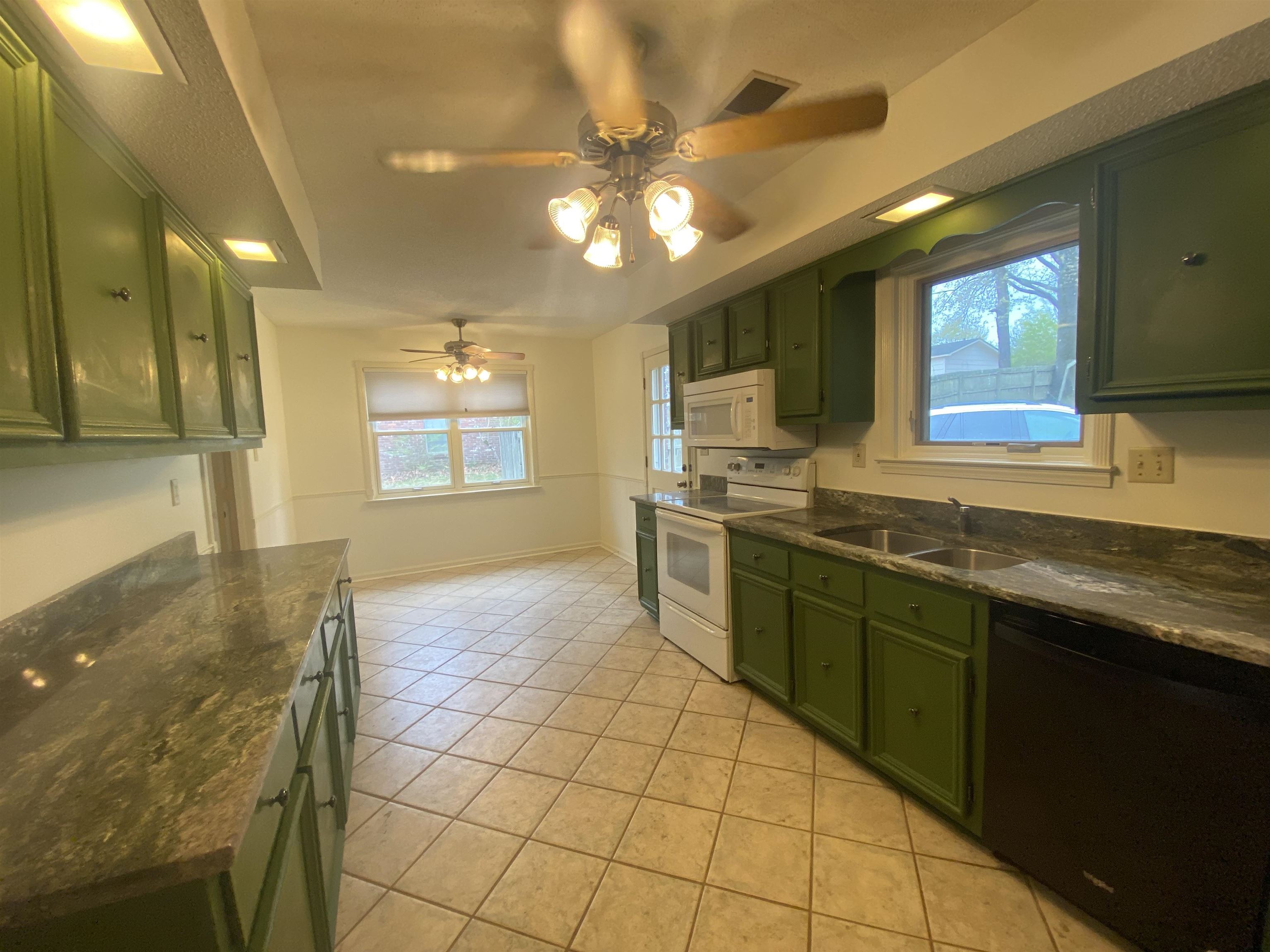 339 Dove Valley Road Collierville, TN 38017 - Photo 6 of 20 a kitchen with stainless steel appliances granite countertop a sink and cabinets