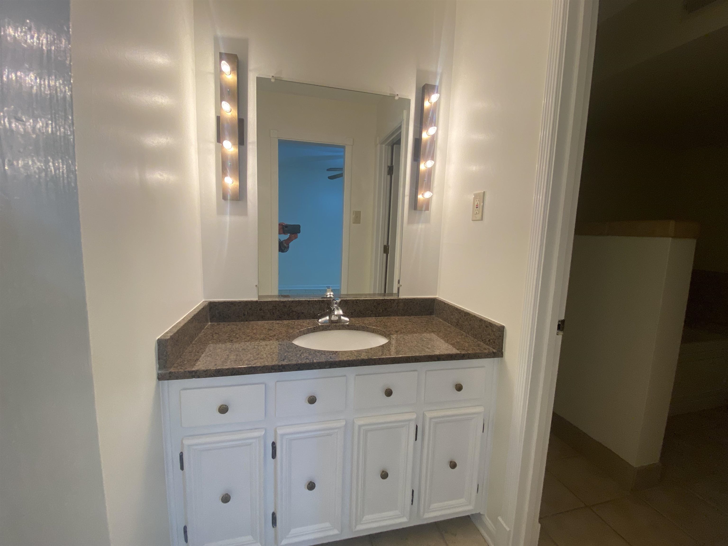 339 Dove Valley Road Collierville, TN 38017 - Photo 8 of 20 a bathroom with a granite countertop sink and a mirror