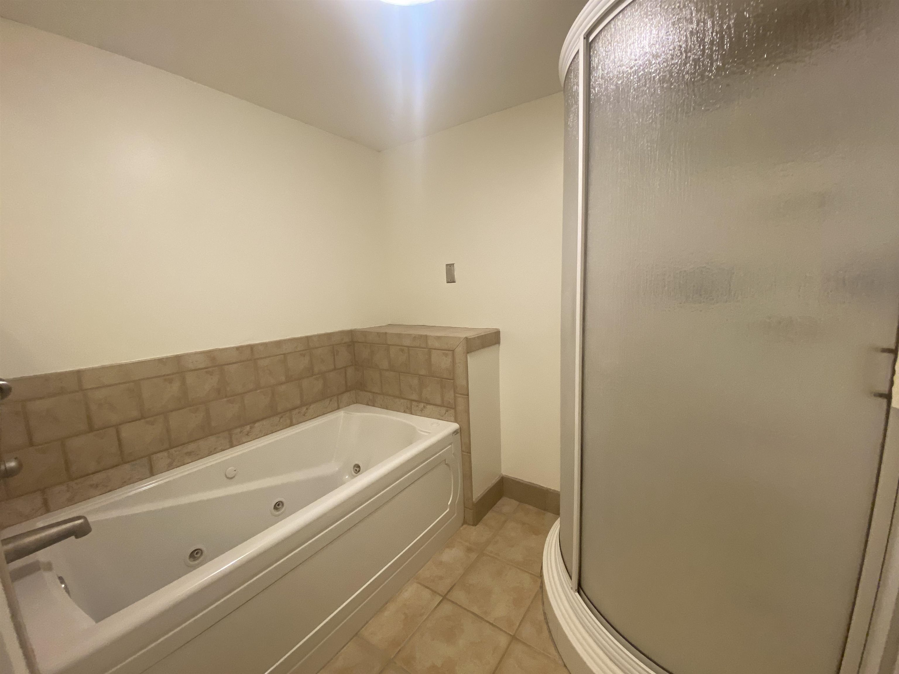 339 Dove Valley Road Collierville, TN 38017 - Photo 10 of 20 a bathroom with a tub and shower