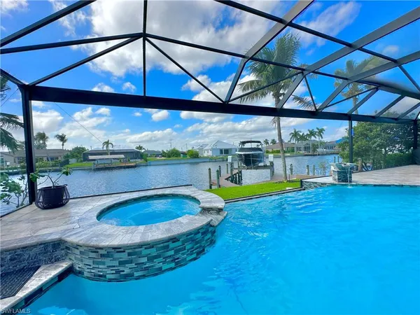 a view of a swimming pool with a patio
