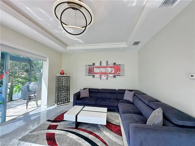 a living room with furniture and a couch