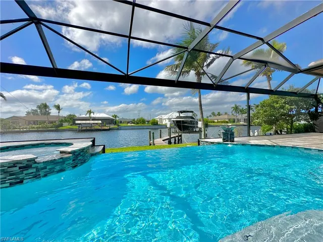 a view of a swimming pool with a patio