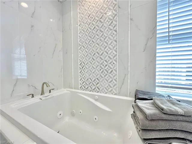 a bedroom with a bed and a chair