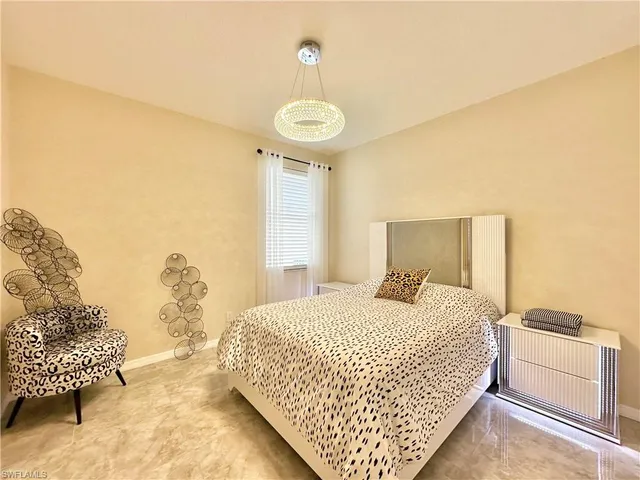 a view of a storage and utility room with washing machine