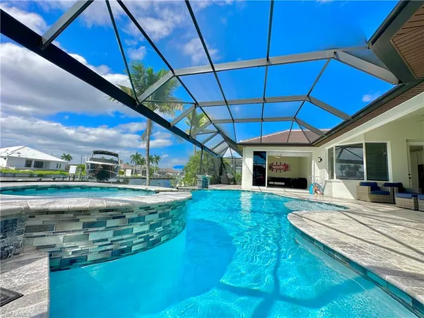 a view of swimming pool with a patio