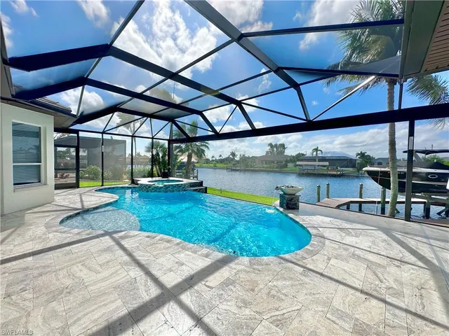 a view of a swimming pool with a yard