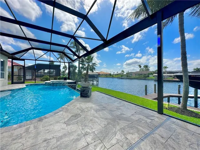 a view of swimming pool with a yard