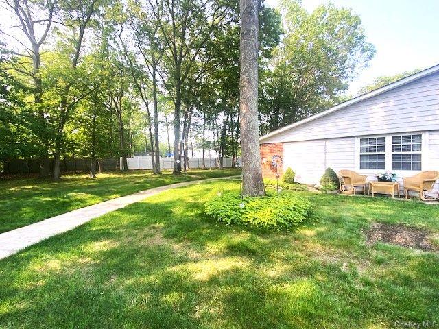 259 Newcastle Court, Unit E Ridge, NY 11961 - Photo 3 of 20 View of yard