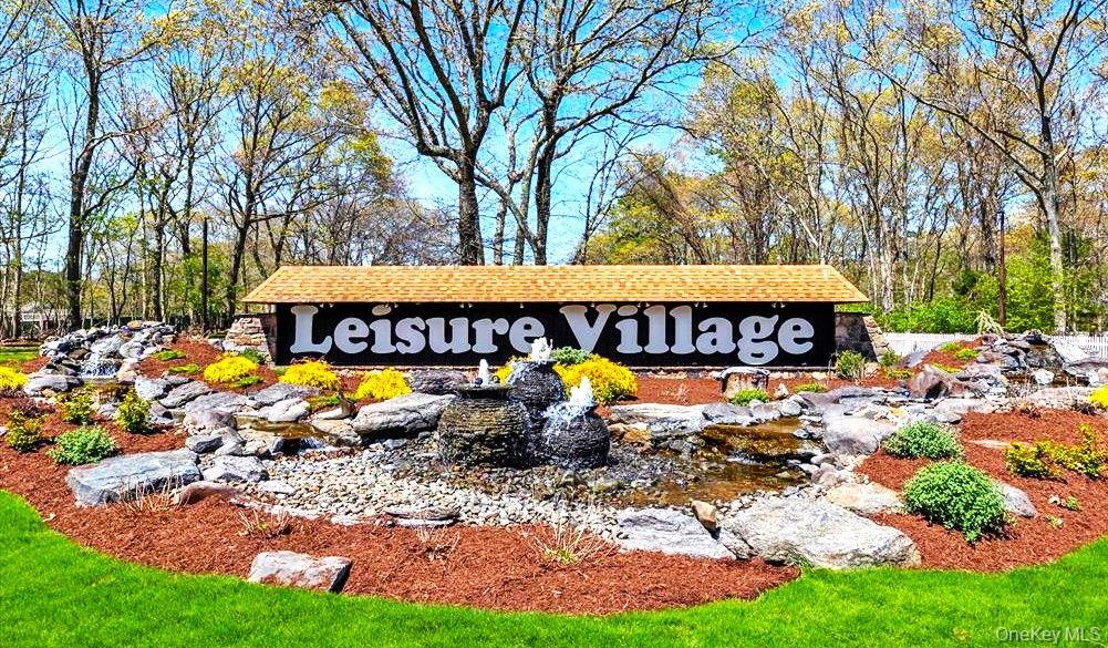 259 Newcastle Court, Unit E Ridge, NY 11961 - Photo 6 of 20 View of community / neighborhood sign