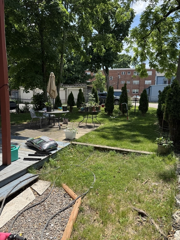 5 Spring Park Avenue, Unit 1 Boston, MA 02130 - Photo 23 of 24 a front view of a house with garden