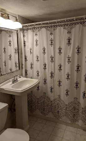 48 Great Road, Unit 22 Acton, MA 01720 - Photo 12 of 18 a bathroom with a sink toilet and shower
