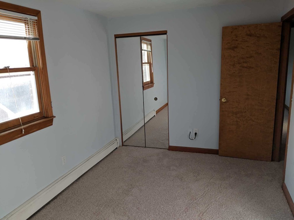 48 Great Road, Unit 22 Acton, MA 01720 - Photo 14 of 18 an empty room with windows