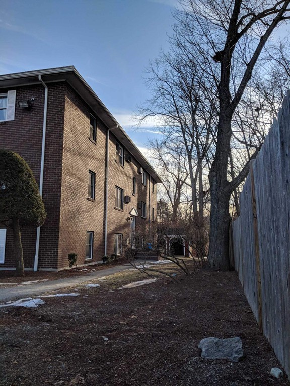 48 Great Road, Unit 22 Acton, MA 01720 - Photo 4 of 18 a front view of house with yard