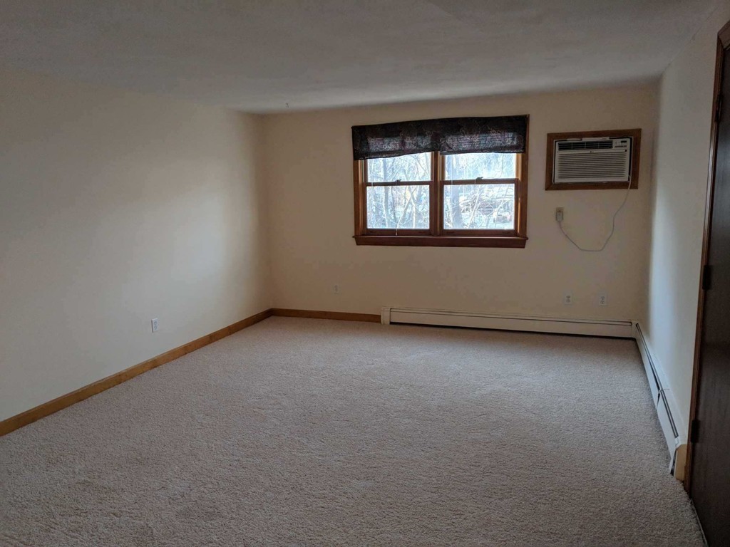 48 Great Road, Unit 22 Acton, MA 01720 - Photo 10 of 18 an empty room with windows