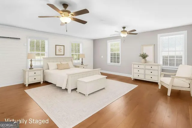 a bathroom with a toilet a sink and a mirror