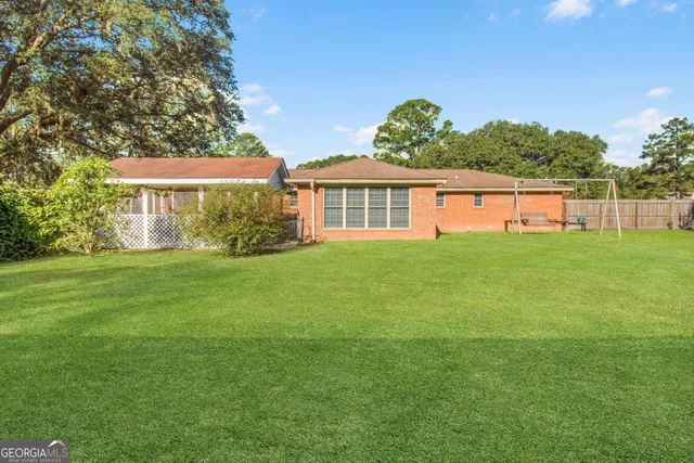 a view of a garden and trees