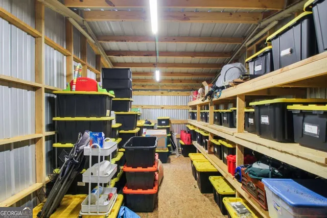 a view of empty room with wooden walls