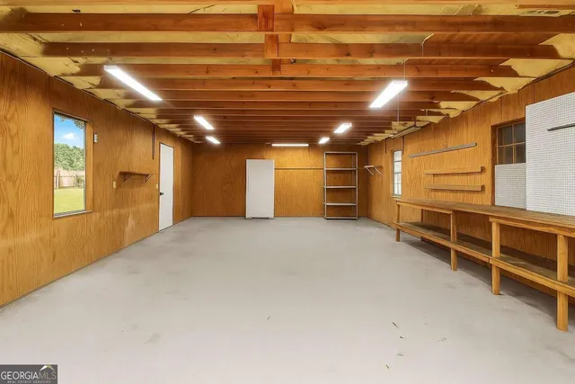 a view of a field of grass and trees