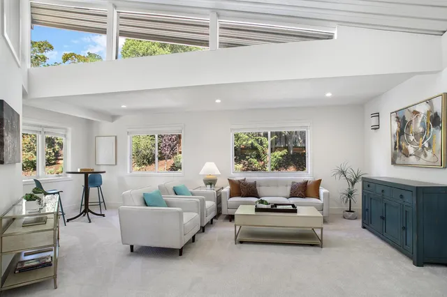 a living room with furniture and a window