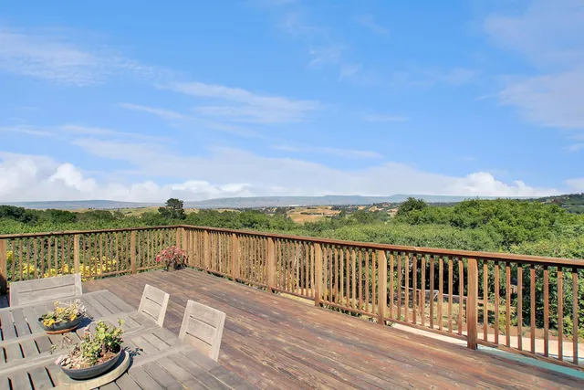 a view of a lake with a chairs