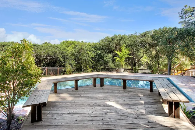 a view of a balcony with two chairs and a table