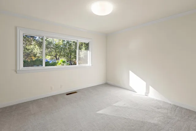 a large kitchen with stainless steel appliances granite countertop a large stove a sink and a large refrigerator