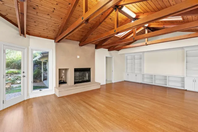 a kitchen with stainless steel appliances granite countertop a stove a refrigerator and a sink