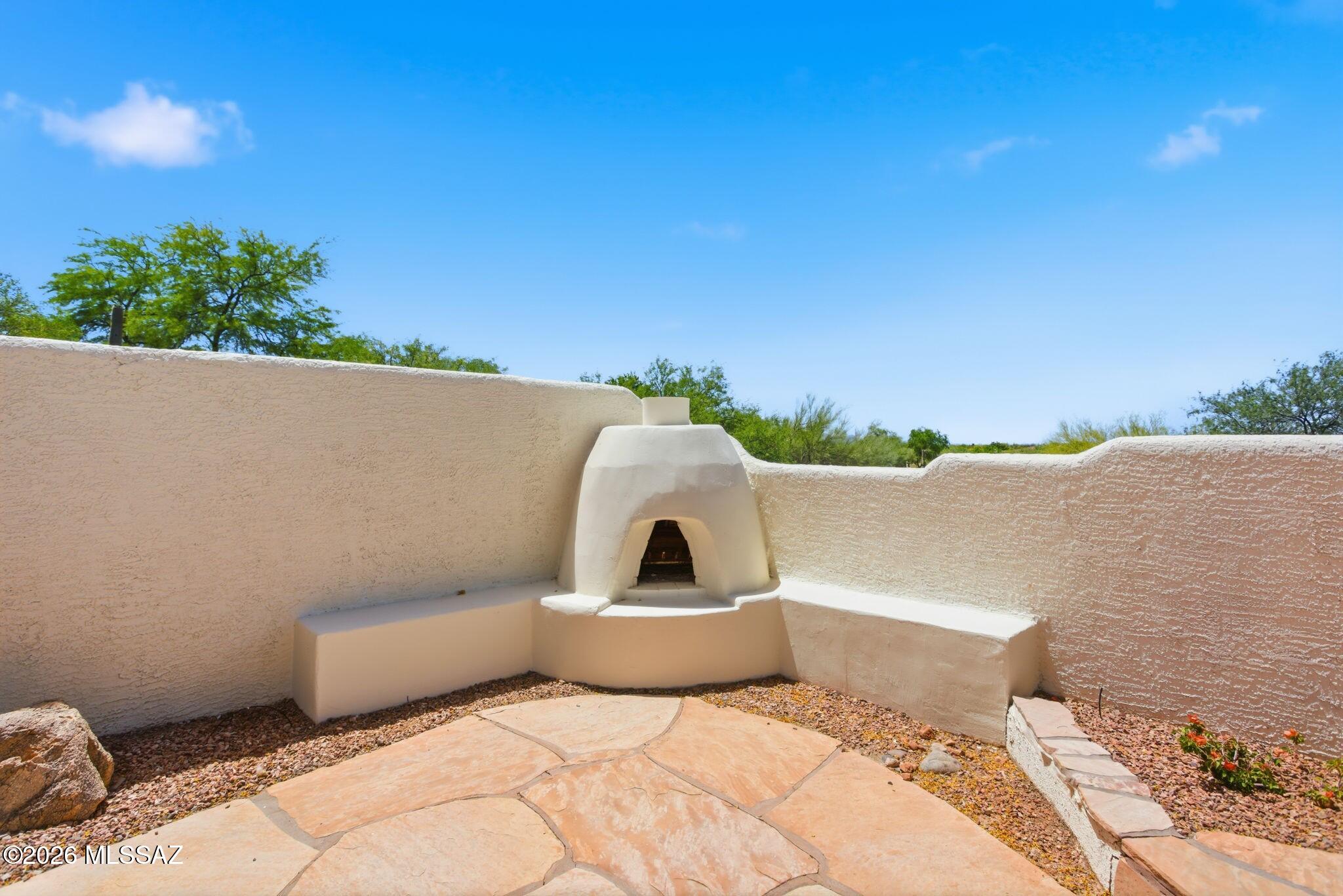 12641 North Rock Creek Road Oro Valley, AZ 85755 - Photo 38 of 48 Backyard Fireplace
