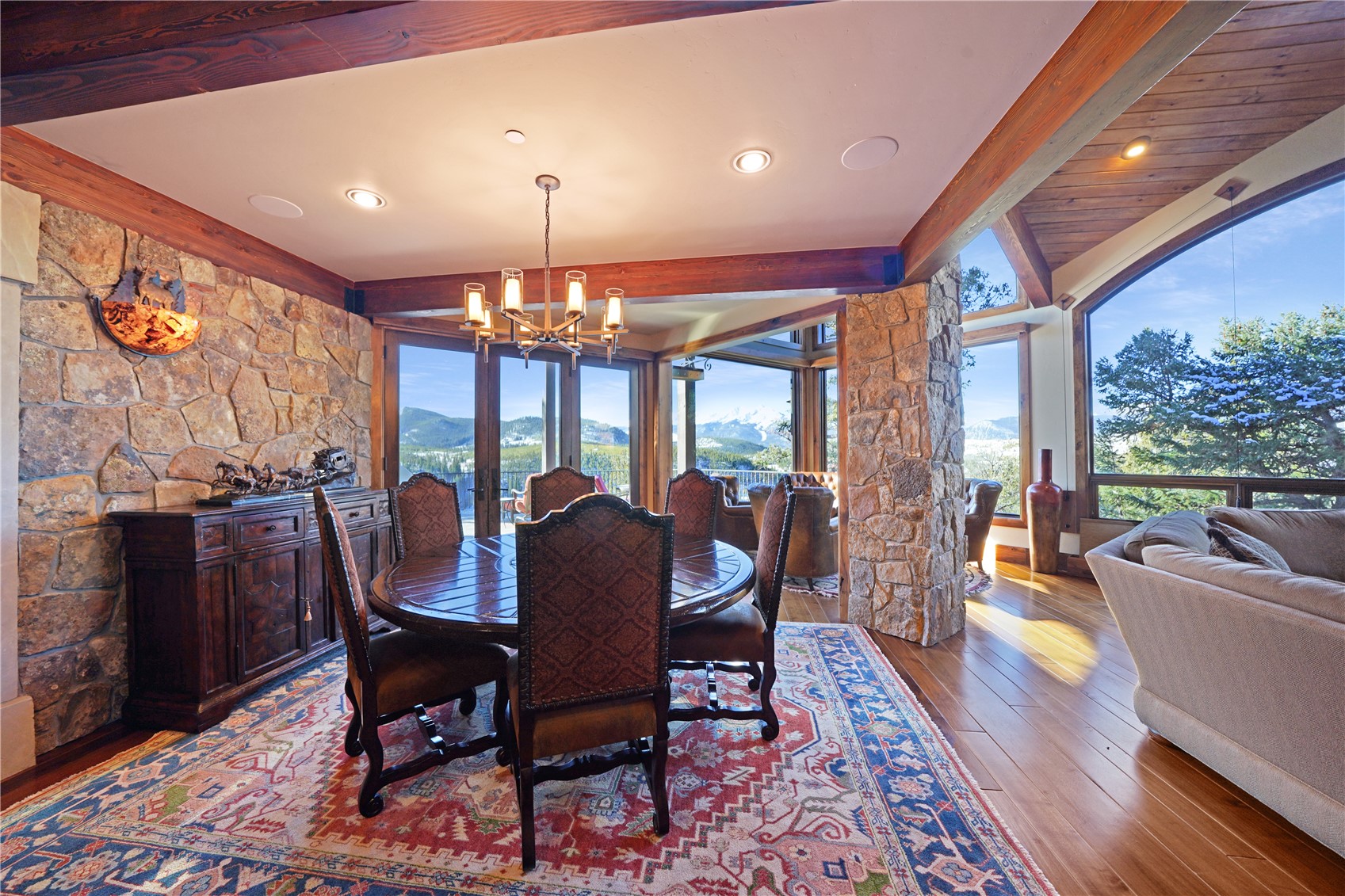 31 Pinnacle Lane Dillon, CO 80435 - Photo 14 of 50 a view of a dining room with furniture a chandelier and wooden floor