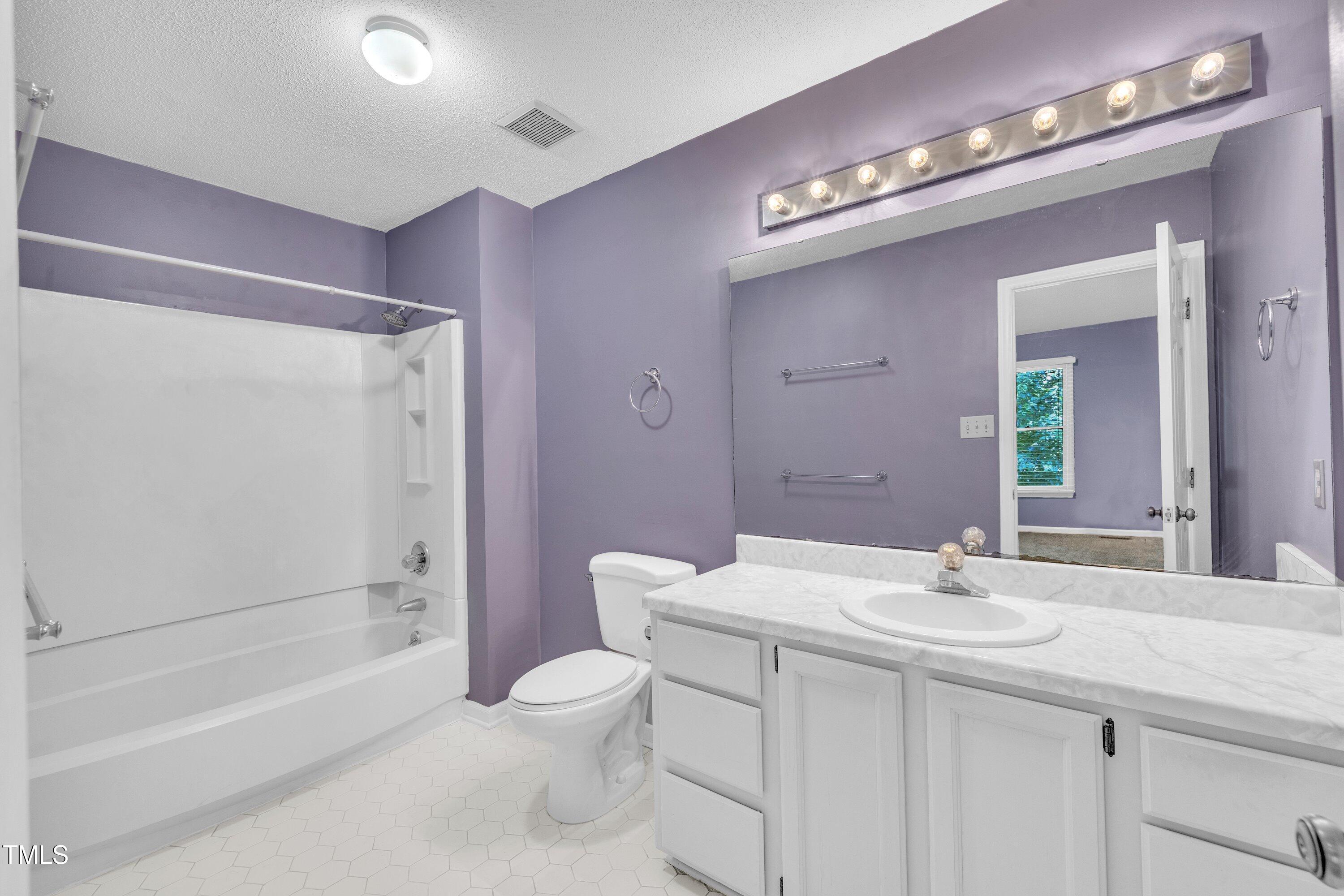 1516 Hemphill Drive Raleigh, NC 27609 - Photo 11 of 28 a bathroom with a sink a toilet and shower