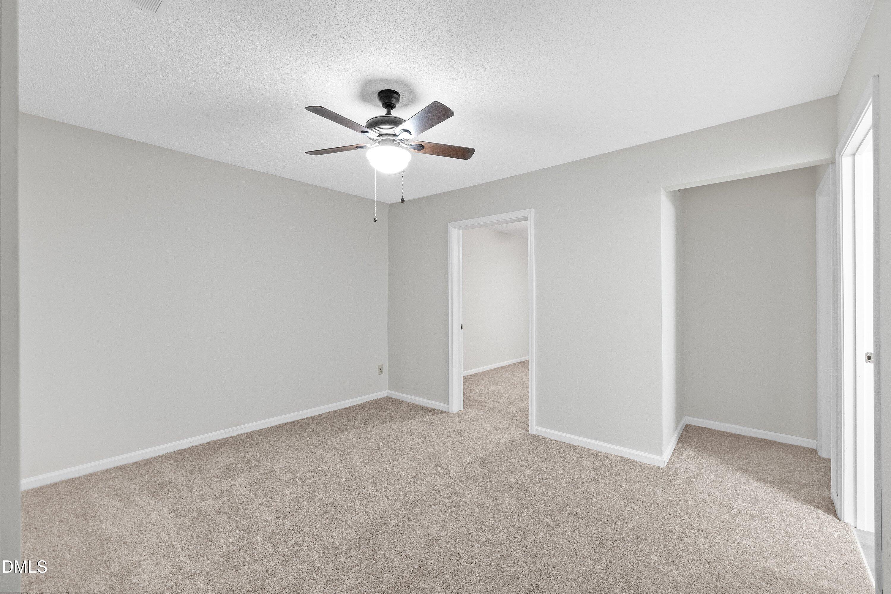 1516 Hemphill Drive Raleigh, NC 27609 - Photo 12 of 28 a view of an empty room with a fan