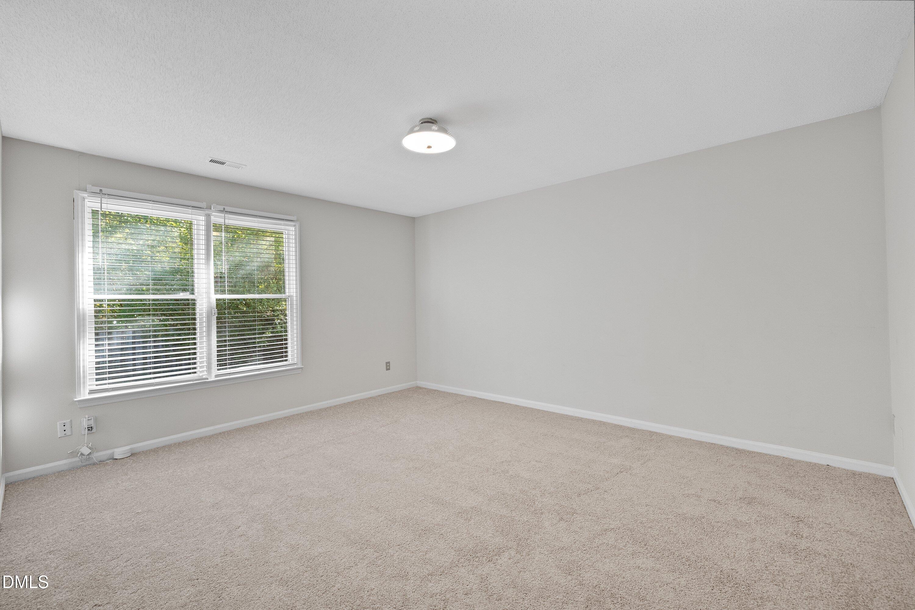 1516 Hemphill Drive Raleigh, NC 27609 - Photo 13 of 28 a view of an empty room with a window