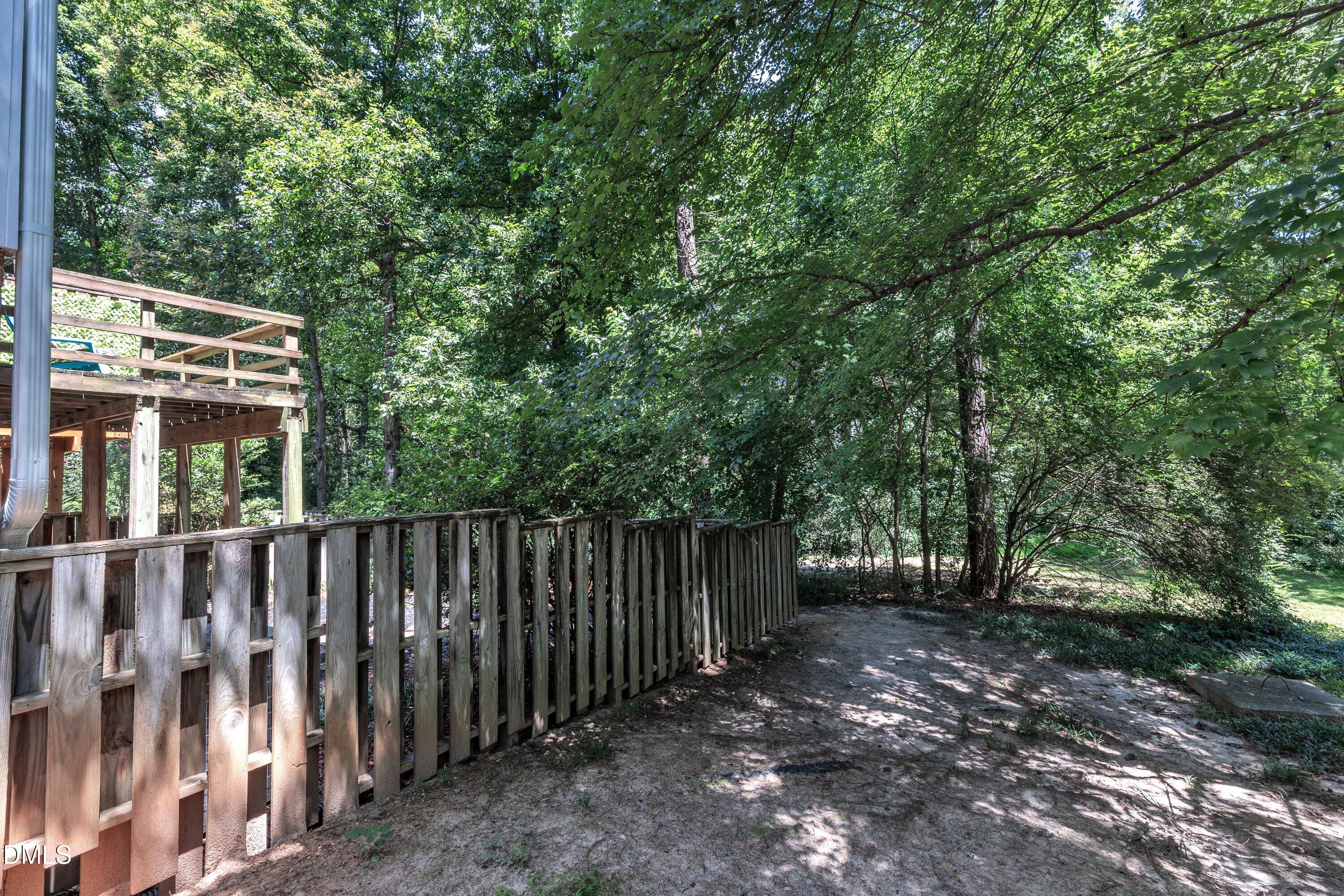 1516 Hemphill Drive Raleigh, NC 27609 - Photo 25 of 28 a view of a wooden fence and trees