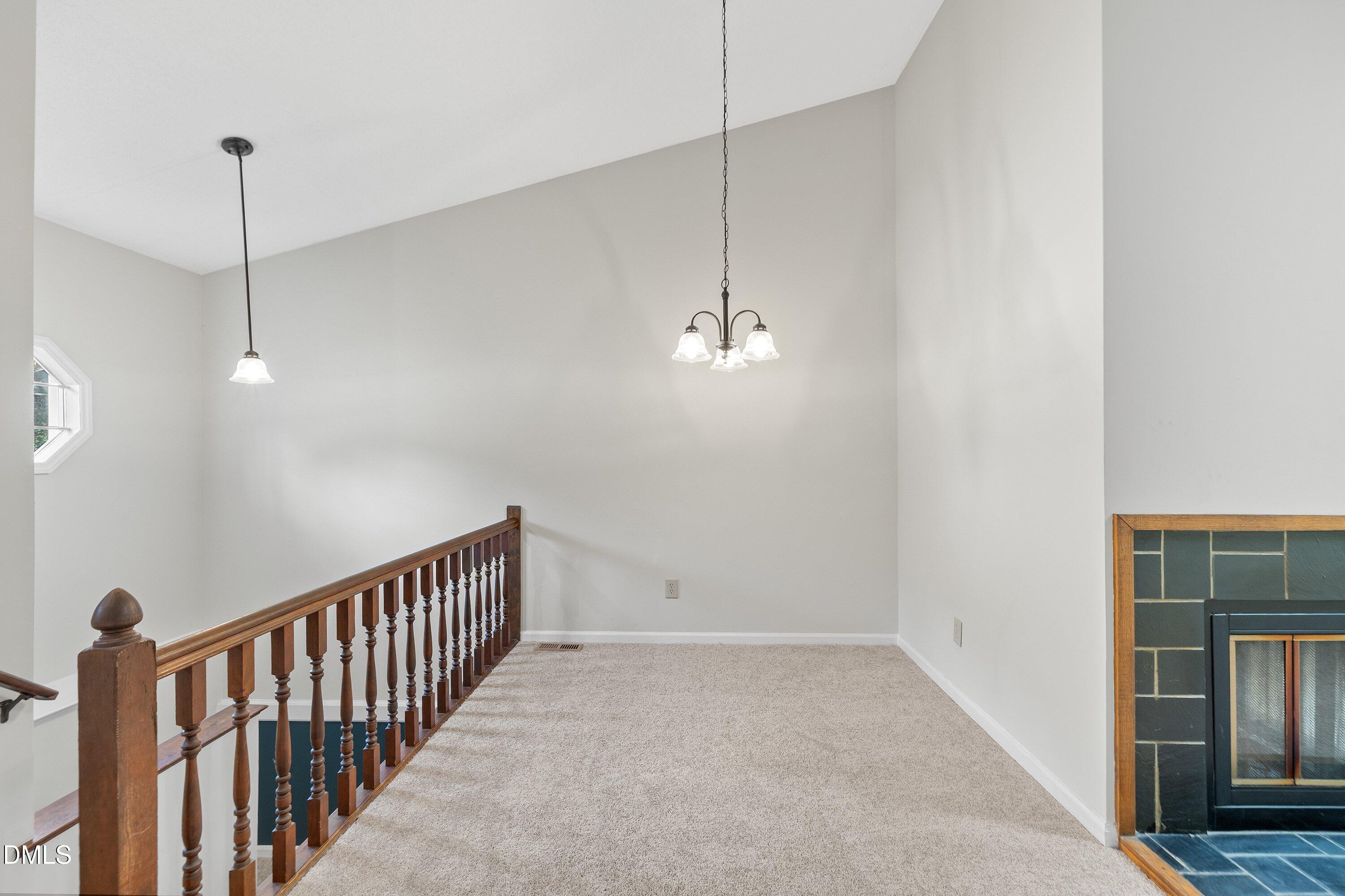 1516 Hemphill Drive Raleigh, NC 27609 - Photo 4 of 28 a view of empty room with wooden floor