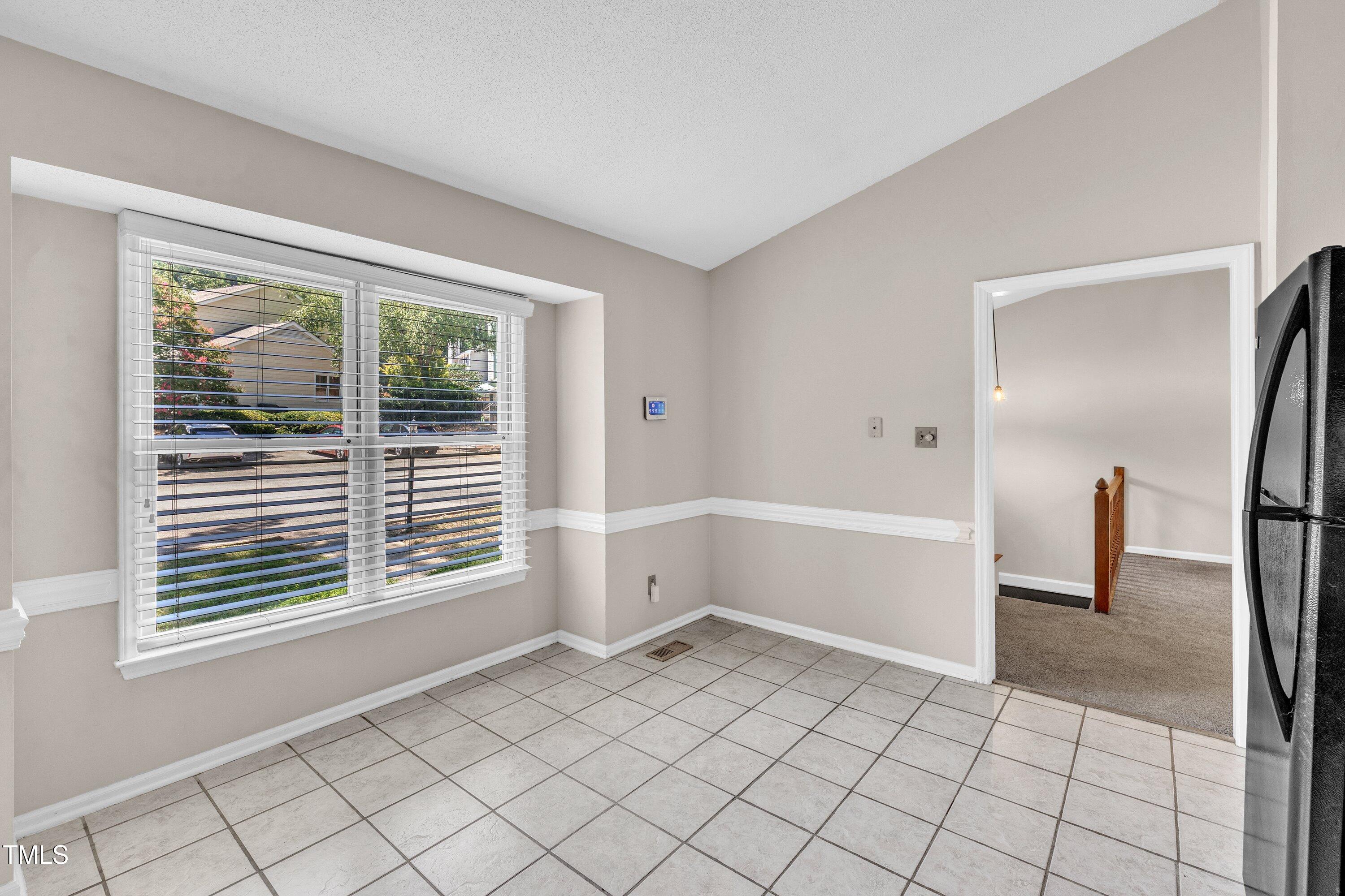 1516 Hemphill Drive Raleigh, NC 27609 - Photo 8 of 28 a view of an empty room with a window