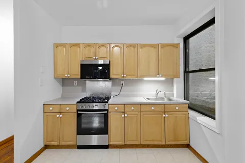 a kitchen with a stove and a microwave