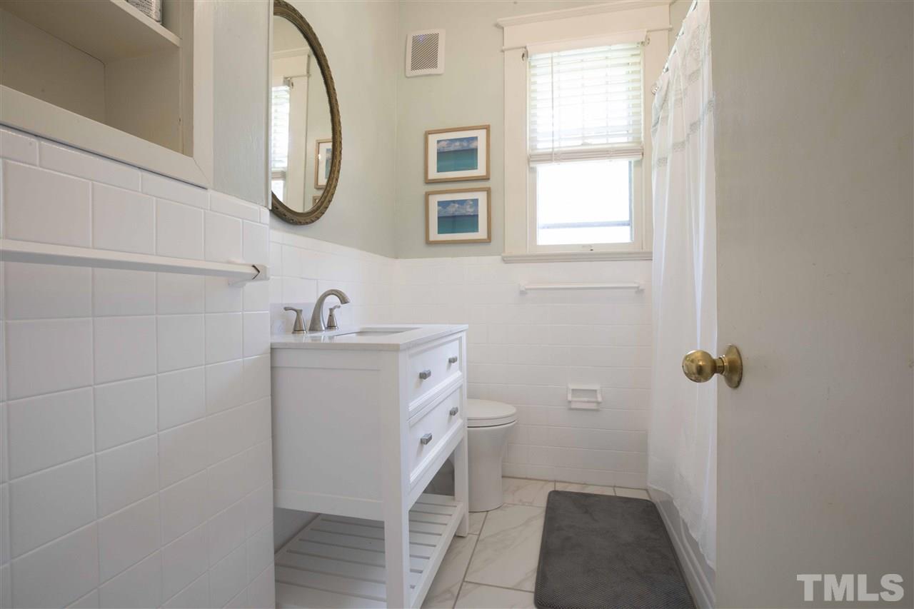 720 North Bloodworth Street Raleigh, NC 27604 - Photo 17 of 27 a bathroom with a sink and a mirror