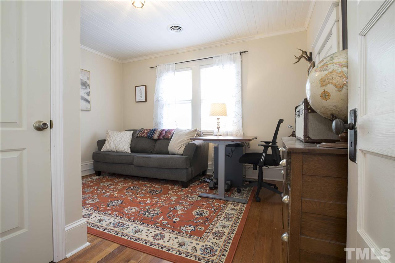 720 North Bloodworth Street Raleigh, NC 27604 - Photo 22 of 27 a living room with furniture and a rug