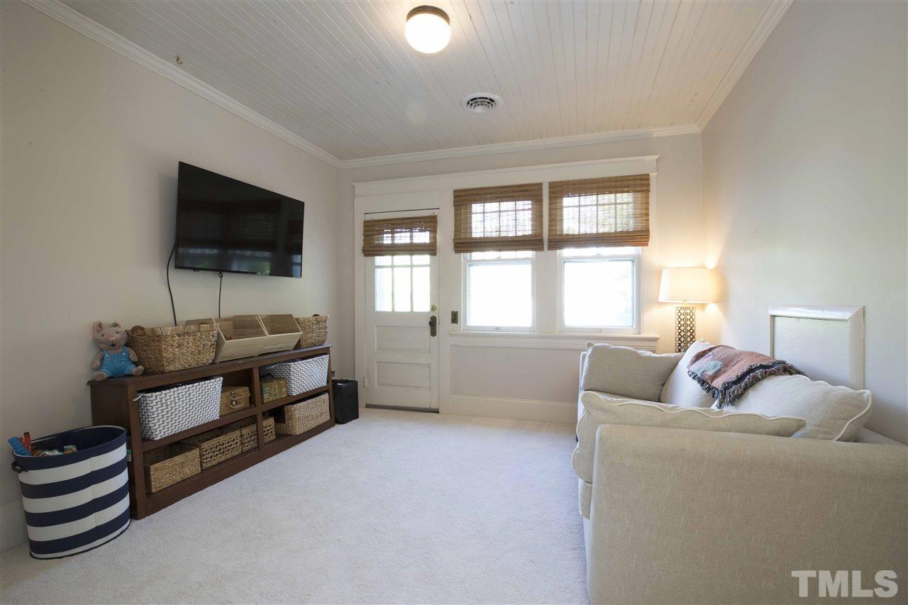 720 North Bloodworth Street Raleigh, NC 27604 - Photo 24 of 27 a living room with furniture and a flat screen tv