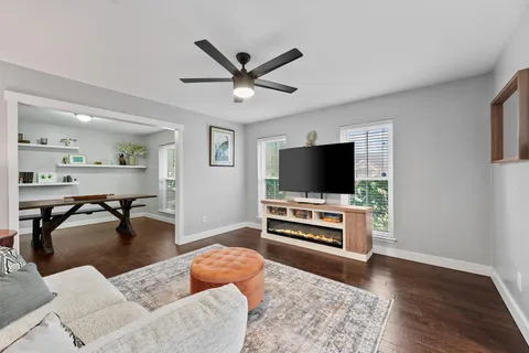 a living room with furniture and a rug