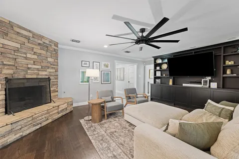 a kitchen with stainless steel appliances kitchen island granite countertop a sink and refrigerator