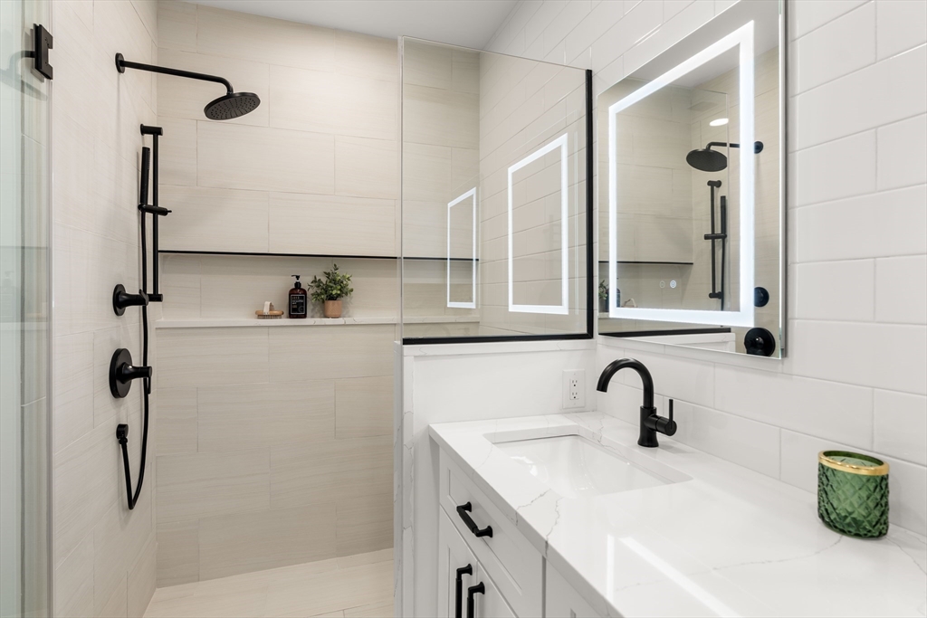 16 Franklin Street, Unit 1303 Salem, MA 01970 - Photo 11 of 31 a bathroom with a sink and mirror