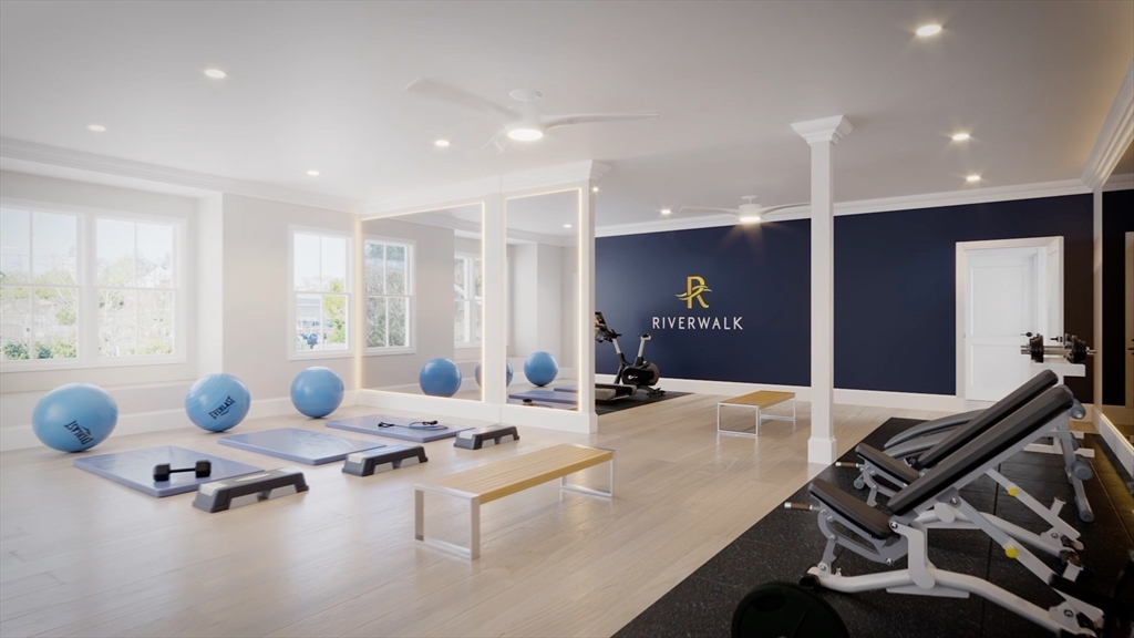 16 Franklin Street, Unit 1303 Salem, MA 01970 - Photo 27 of 31 a living room with furniture and air hockey table