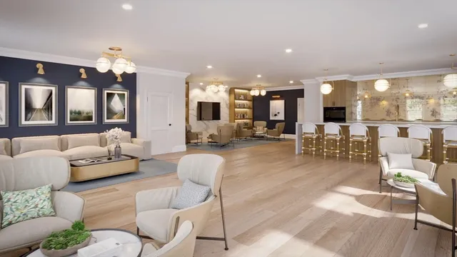 a living room with furniture and view of kitchen