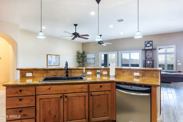 a room with a table chairs and a wooden floor