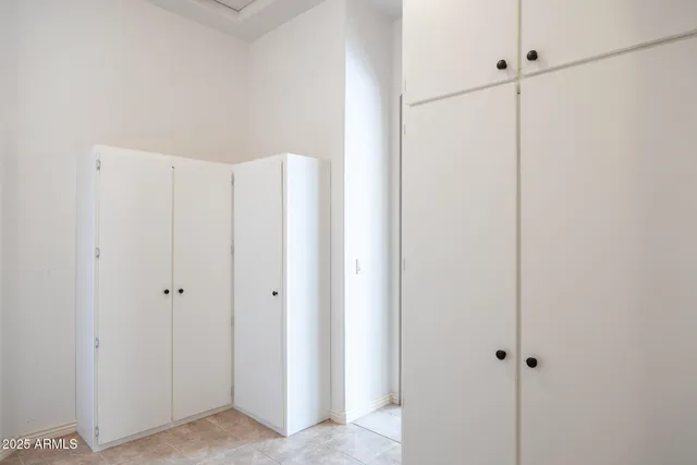 a dining room with furniture and a flat screen tv