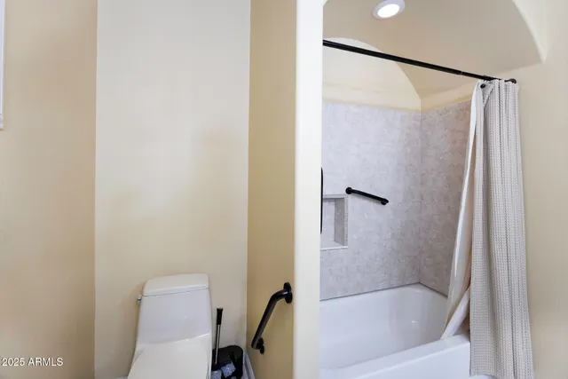 a view of a terrace with couches and sky view