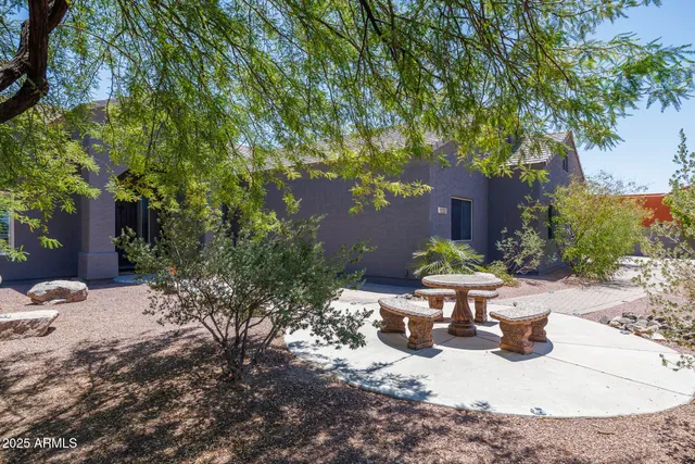 a view of a dinning table and chairs in patio